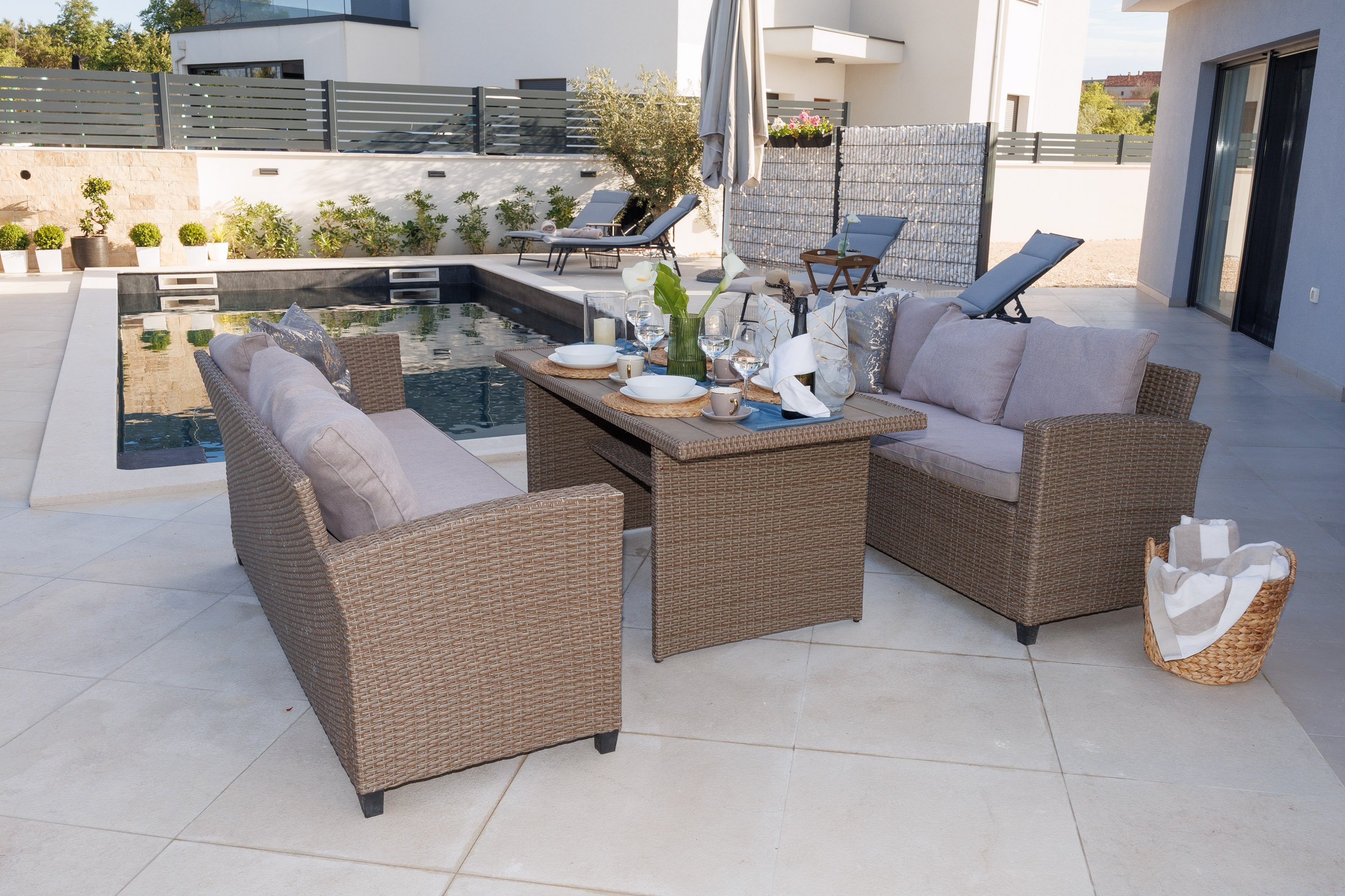 Outdoor rattan lounge by the pool