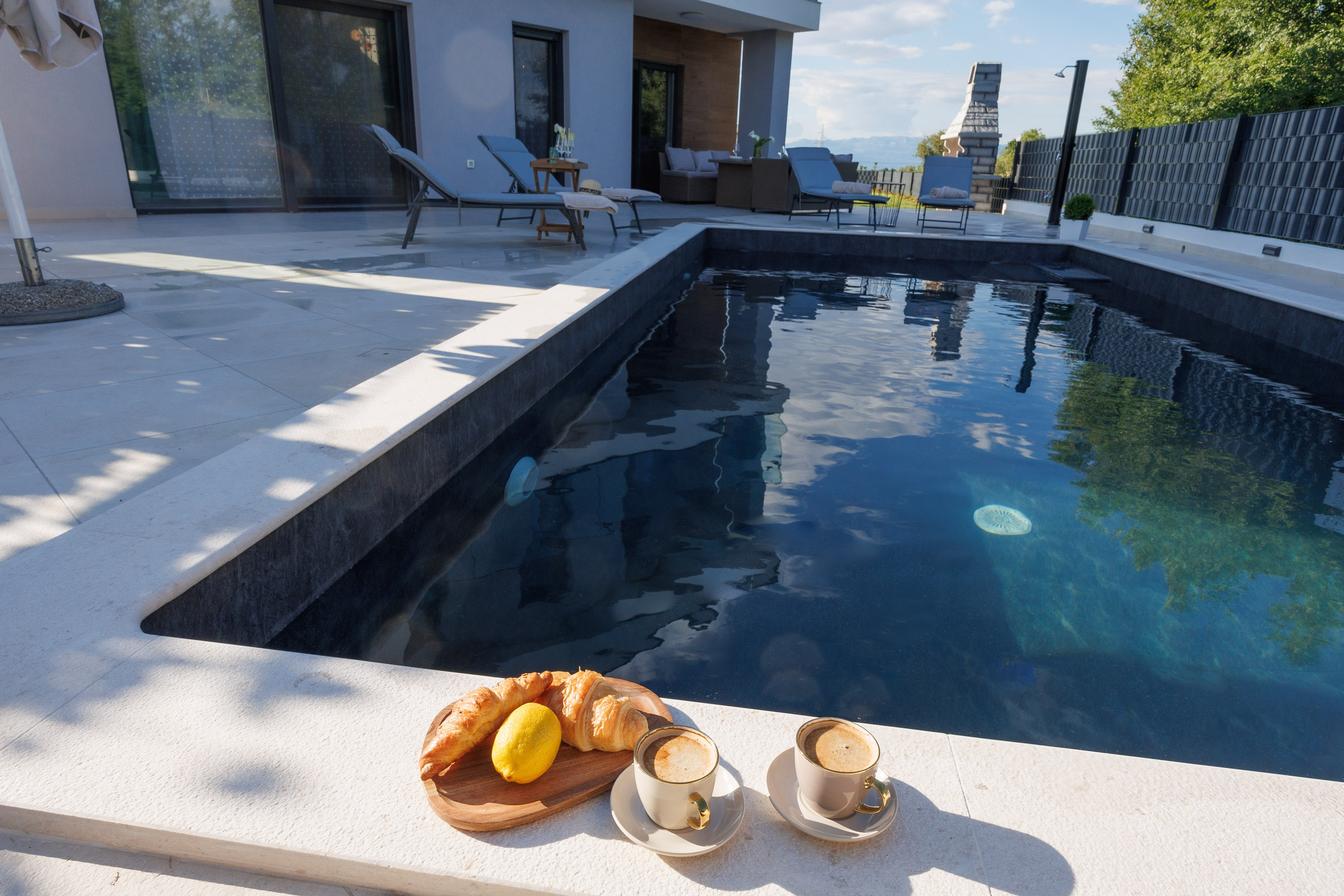 Coffee and croissants by the pool