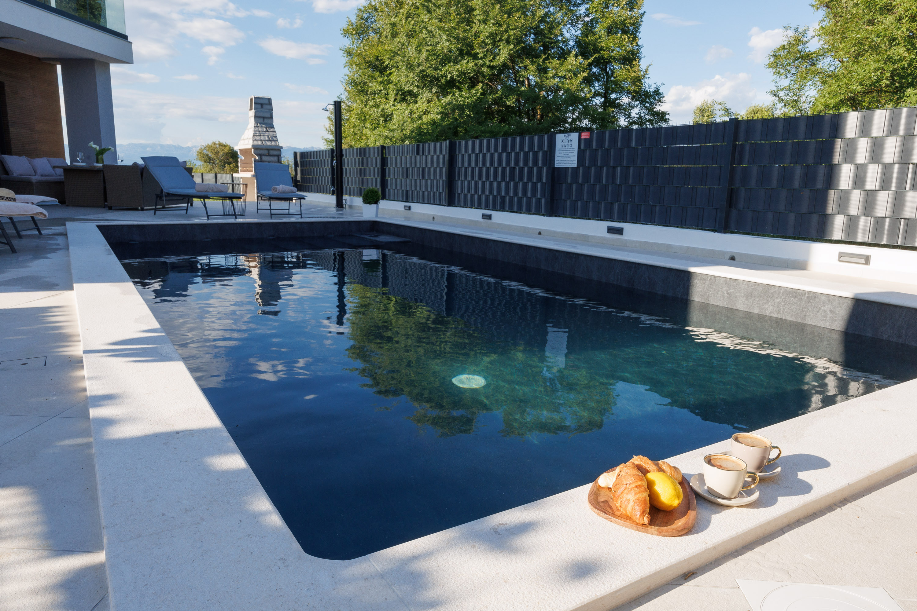 Pool with outdoor fireplace